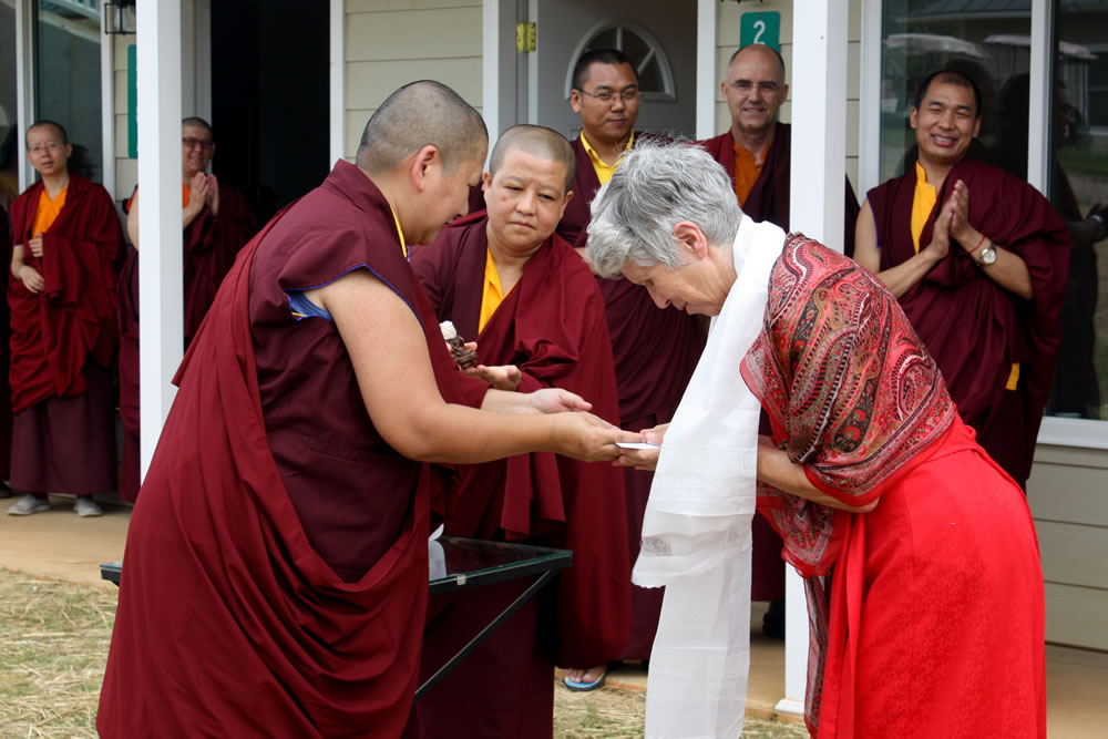 Jetsün Khandro Rinpoche presents Patricia Deer with the keys to her retreat room