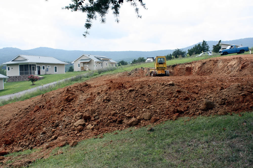 In late summer 2014, the ground is leveled at the site of the future retreat building.
