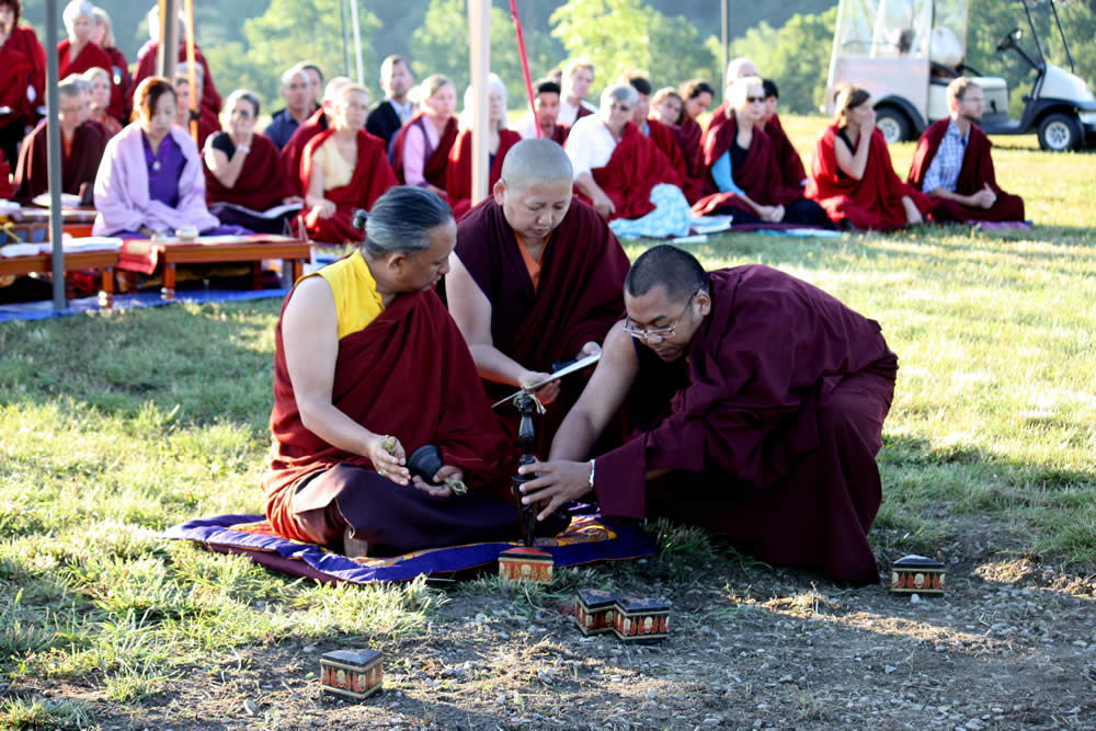 HE Dzigar Kongrul Rinpoche with Mindrolling Jetsün Khandro Rinpoche and Ven. Acarya Namdrol Gyatso prepare to plant the kilas in the 10 directions of the mandala.