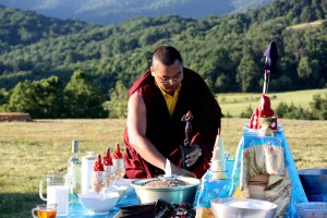 Ven. Acarya Namdrol Gyatso with a kila which will mark one of the ten directions.