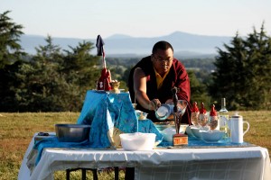 Ven. Acarya Namdrol Gyatso gathers the sang ingredients to offer into the fire.