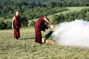 Ven. Acarya Namdrol Gyatso and Drupön Roar Vestre add sang substances to the fire.