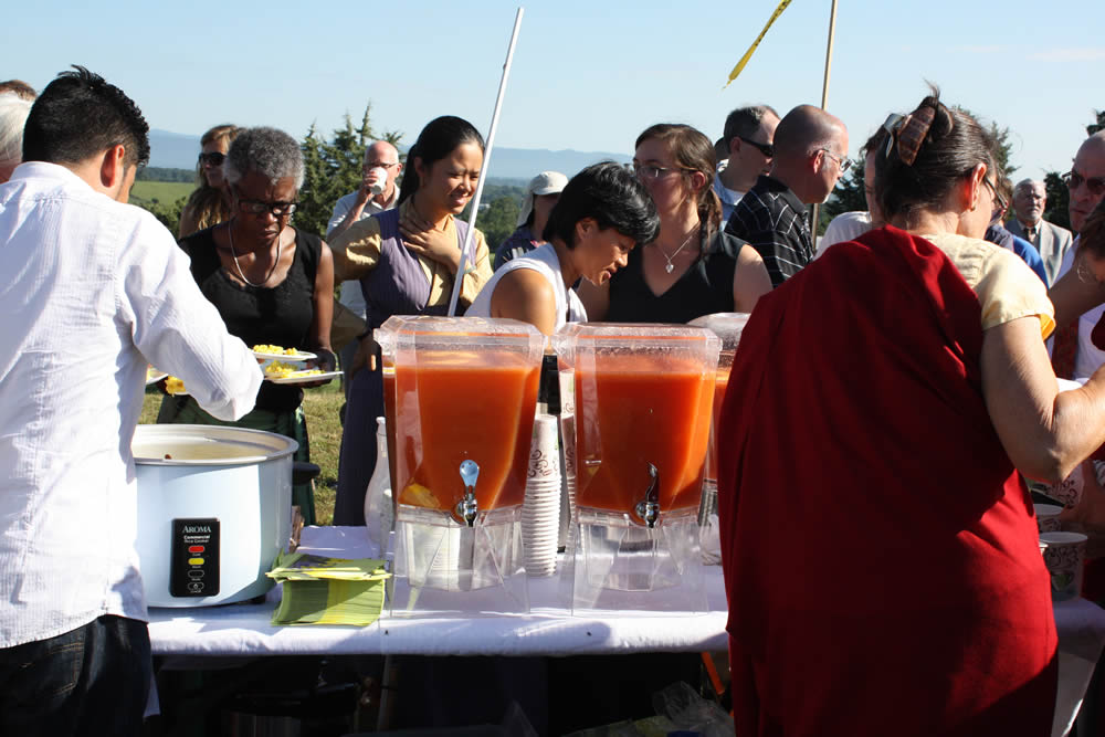 Sangha members enjoy the celebratory tea, rice  and snacks.