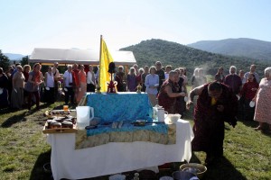 HE Jetsün Khandro Rinpoche playfully tosses celebratory tsampa at Ven. Acarya Namdrol Gyatso.