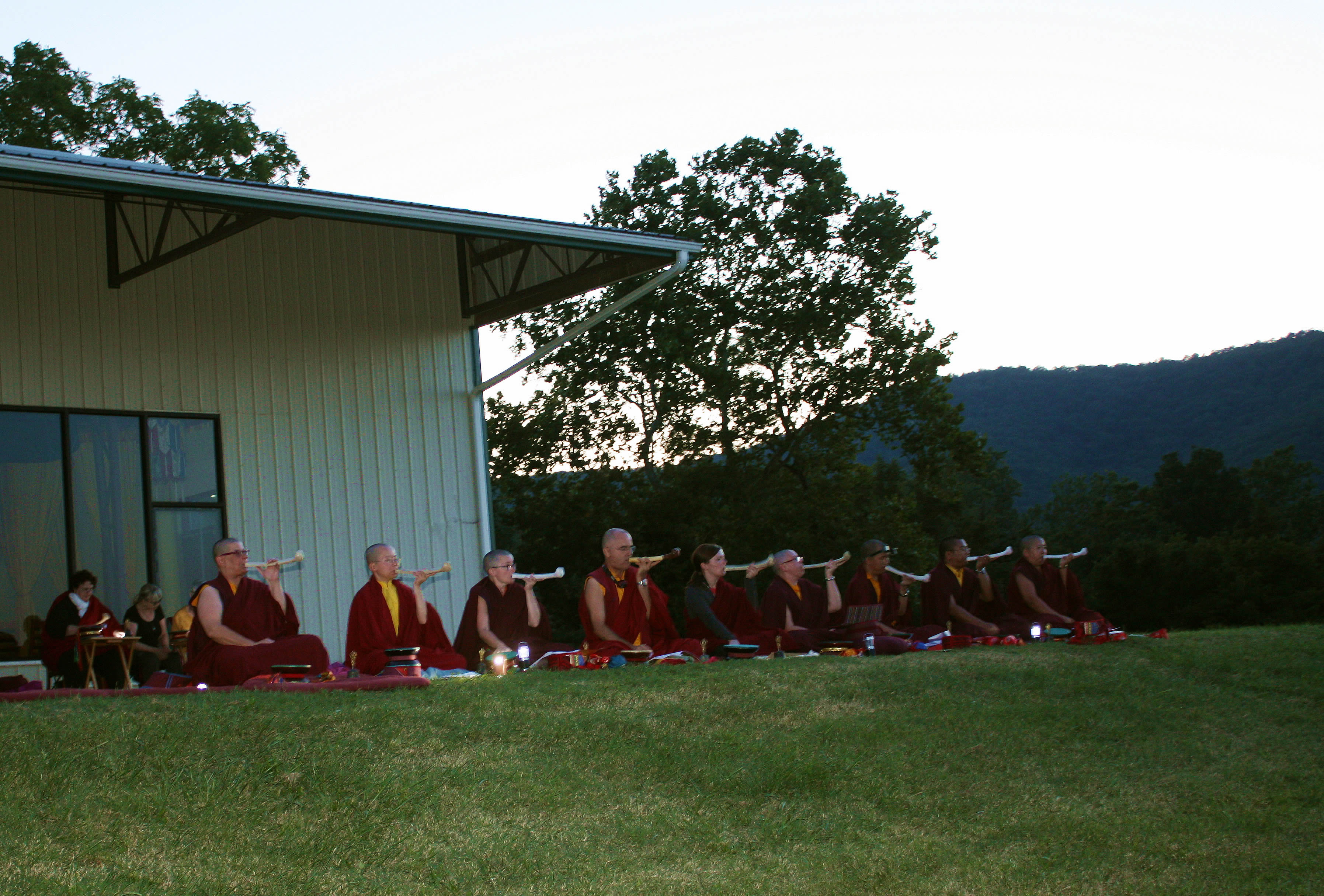 Jetsün Khandro Rinpoche with monks and nuns.
