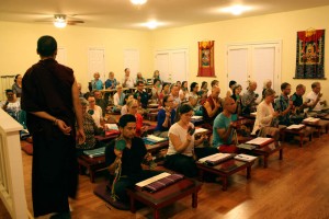 Ven. Thrinley Gyaltsen watches students during the instrument practice session.