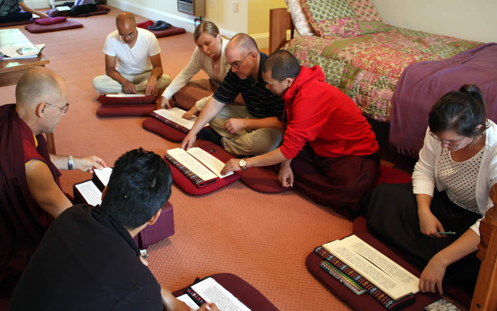 Ven. Thrinley Gyaltsen instructs students during a textual reading session.