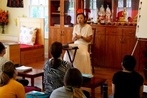 Minling Jetsün Dechen Padrön demonstrating a mudra.