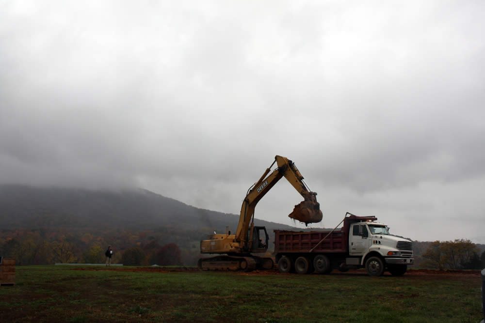 OCTOBER 28&mdash;Work continues on a rainy day, as builder Mark Good checks on the progress.