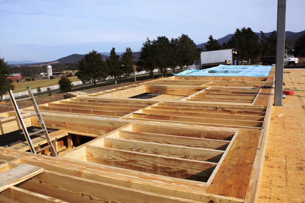 12 JANUARY—Southern wall sections lie flat. The large openings are for the windows. The walls will be raised by crane upon completion.