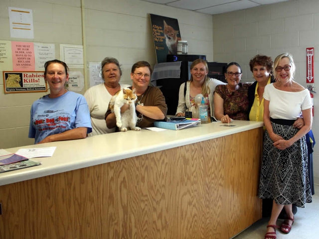 Members of the sangha pose with staff of the Page County Animal Shelter, one of the charities to whom Lotus Garden makes an annual donation in honor of Dungse Rinpoche's birthday.