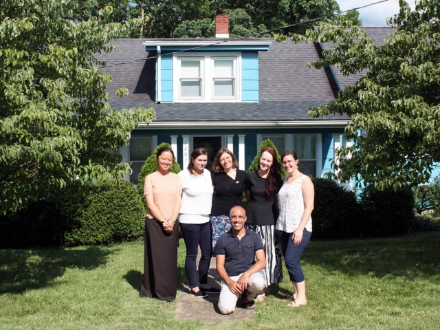 Lotus Garden purchased an adjoining property with a house. Here the European residents pose in front of their new residence, called the Blue House.