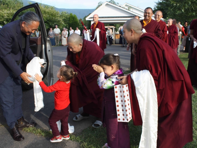 His Eminence Dzigar Kongtrul Rinpoche is greeted by Dungse Rinpoche, Jets&uuml;n Rinpoche, Her Eminence Jets&uuml;n Khandro Rinpoche, monks, nuns and sangha members.