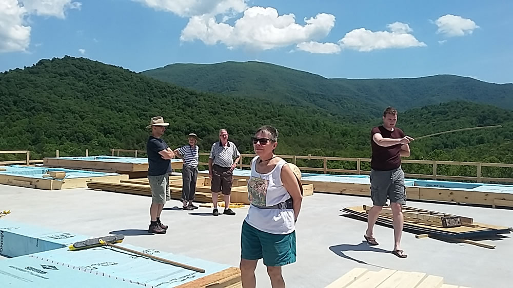 JUNE 10-Britton Bosarge and sangha members take a last look at the vast 360 degree view on the 2nd floor before the walls are raised.