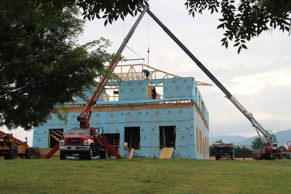 JULY 14-Hip tails installed being installed on western side of temple.