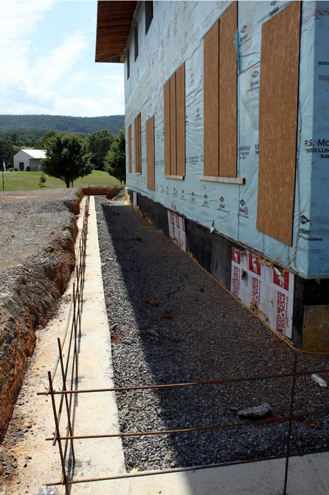 JULY 15-Veranda footers have been installed. The 10 foot wide veranda will run around the entire building. The surface will be a patterned concrete.
