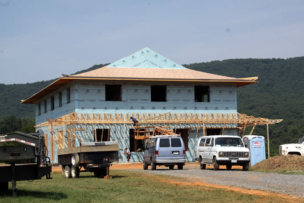 JULY 19-Workers constructing the verdanda roof on the front side of the temple.