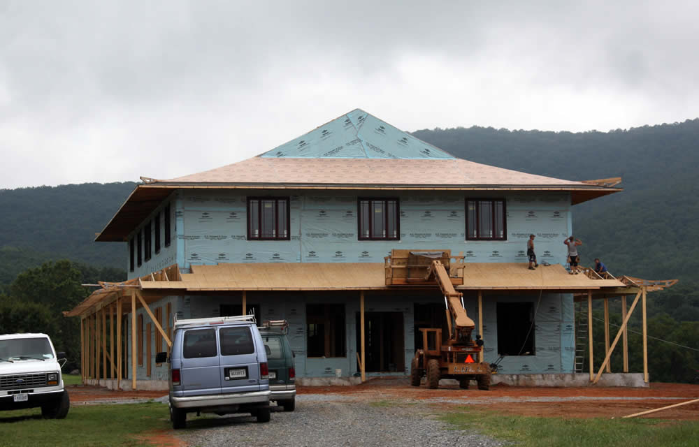 AUGUST 15-Working on the veranda roof which will surround the entire temple.