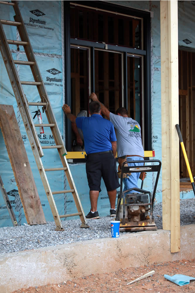 August 23-Installing frames for the first floor windows.