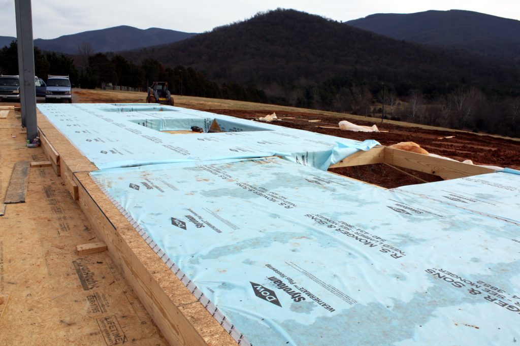 13 JANUARY—View to southeast with Tyvek-wrapped wall sections.