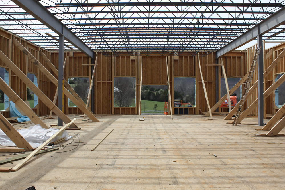 5 APRIL—View of first floor interior showing the metal joists for the second floor.