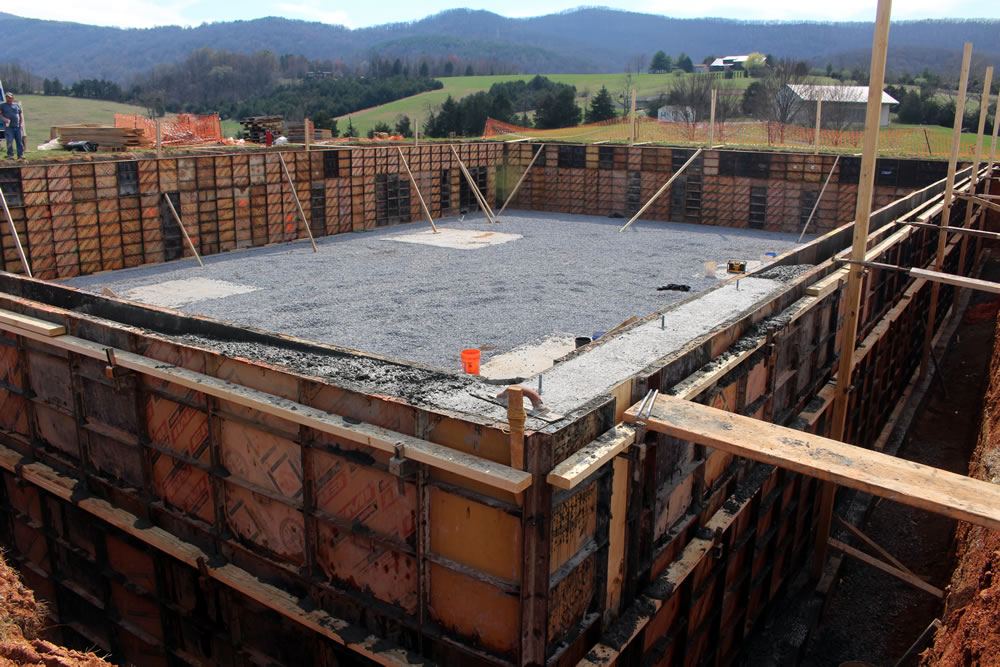 MARCH 23-Section of wall-forms showing poured concrete. Workers used planks to mount the wall to smooth the new concrete.
