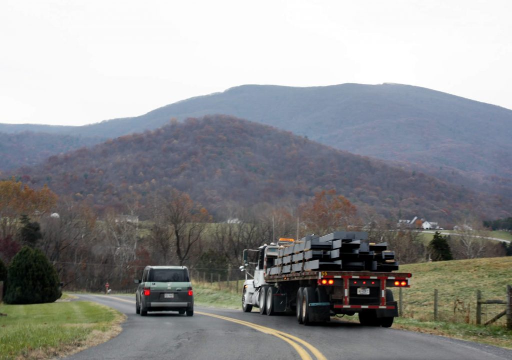 NOVEMBER 28-Truck carrying steel beams approaches Lotus Garden.