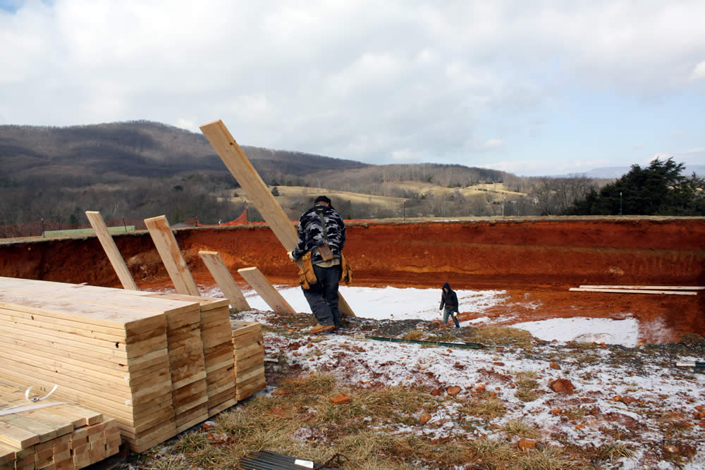 fter a delay due to winter weather and with snow still on the ground, the construction team arrives from Charlottesville to begin the temple foundation.
