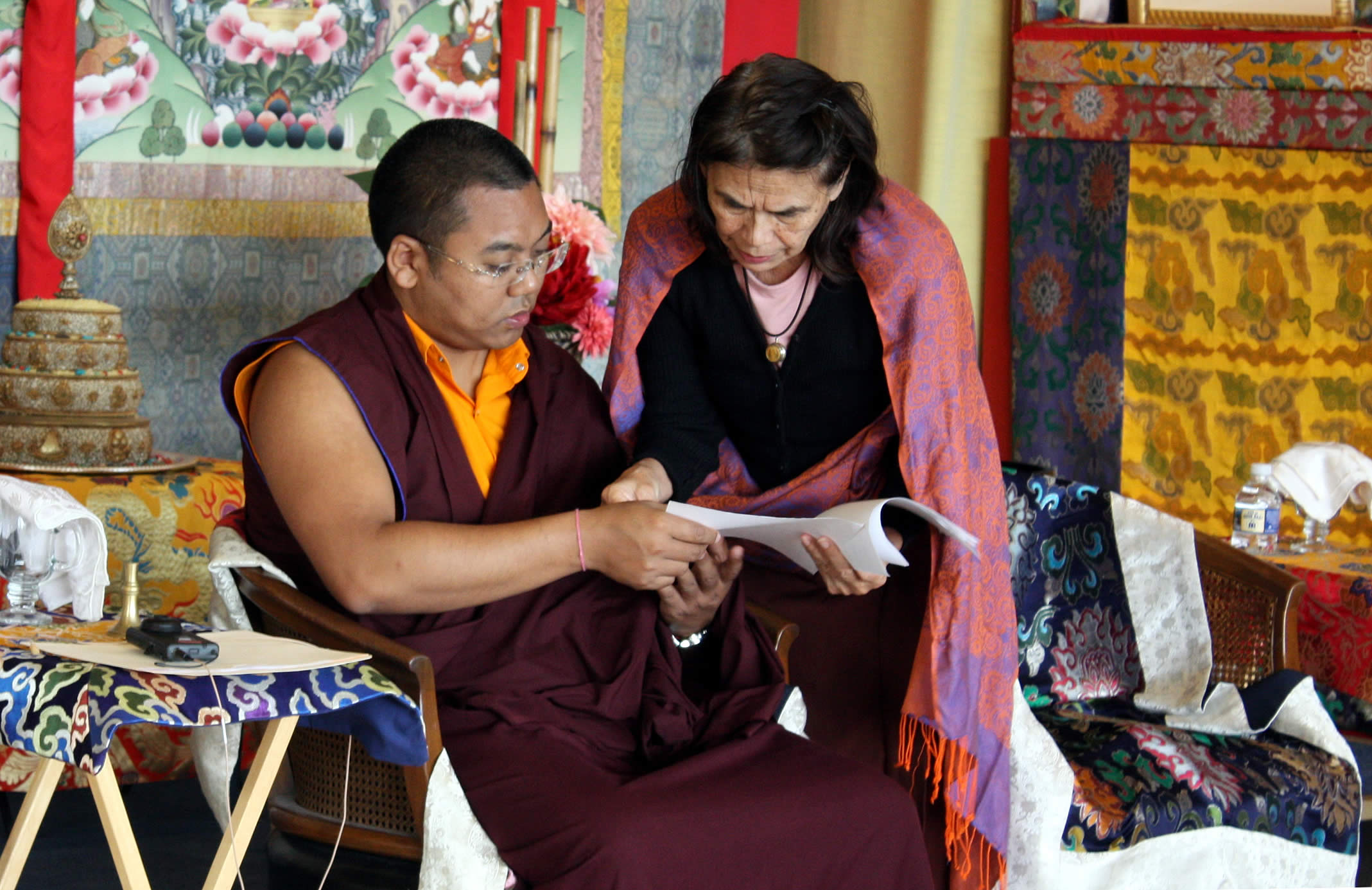 Ven. Acarya Namdrol Gyatso works with a student during Tibetan language class