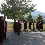 Rinpoches, monks and nuns await the arrival of Dzigar Kongtrul Rinpoche