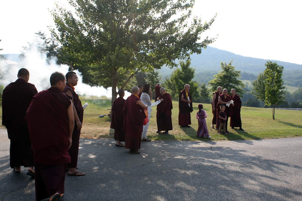 Rinpoches, monks and nuns await the arrival of Dzigar Kongtrul Rinpoche