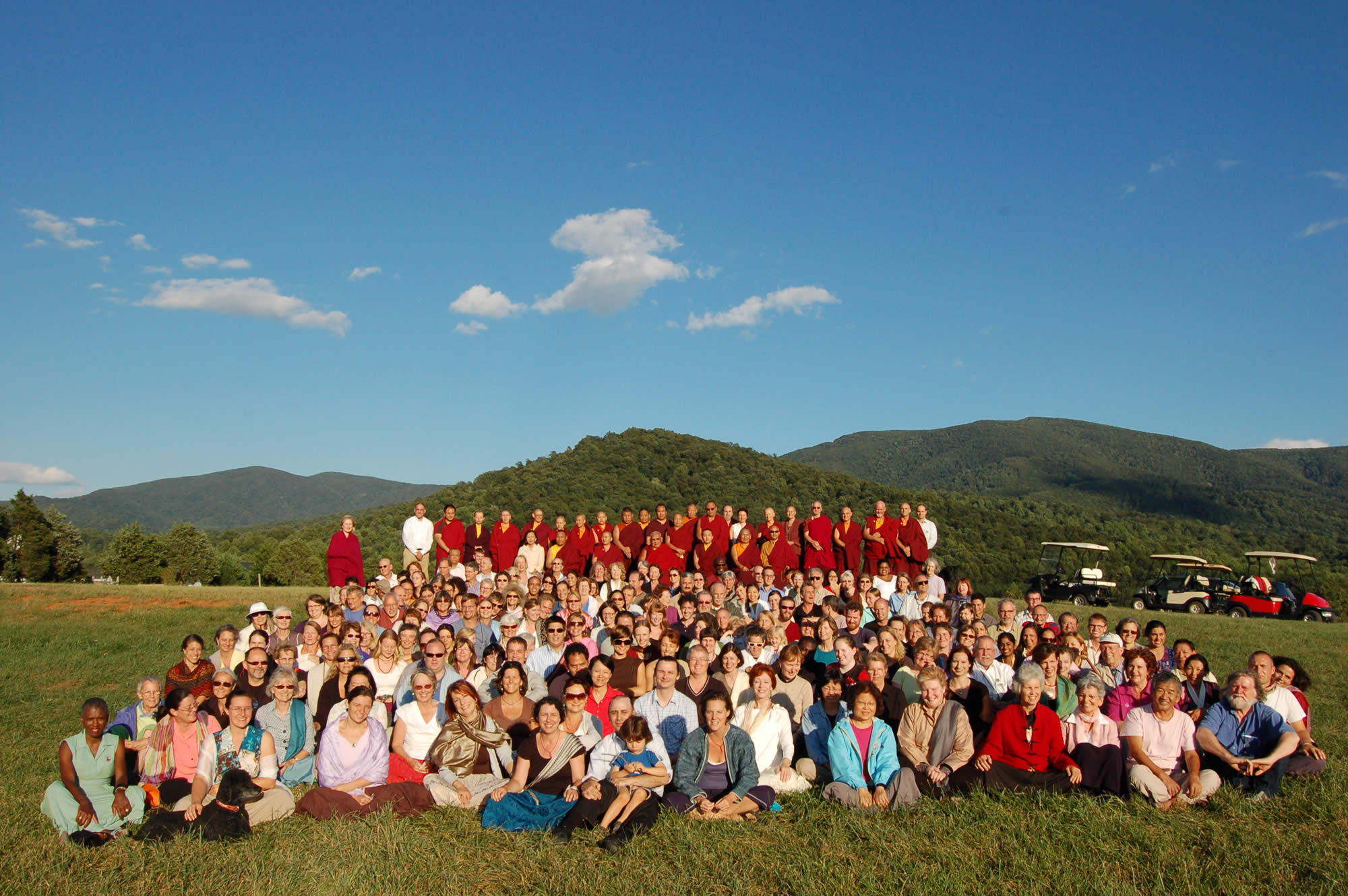 Kyabje Taklung Tsetrul Rinpoche gathers with sangha members on the site of the future Mindrol Gatsal, 2010