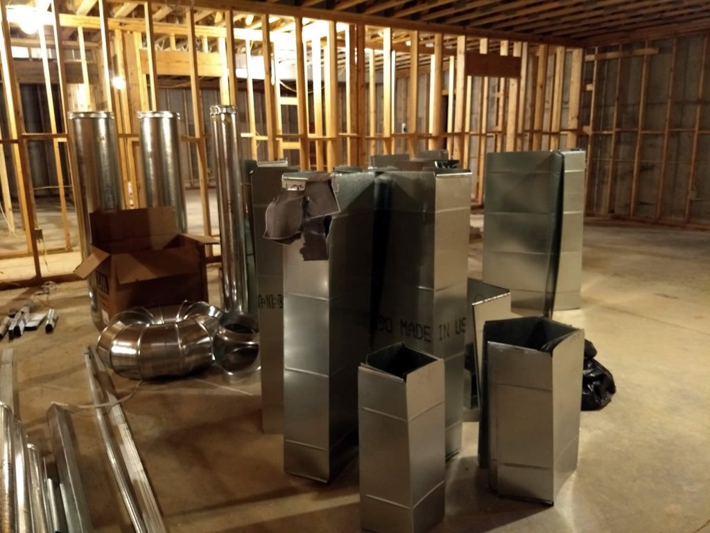 Galvanized steel ducting awaits installation in the temple. The HVAC system will keep the temple cool in the summer heat and warm when the cold winter winds blow at Lotus Garden.