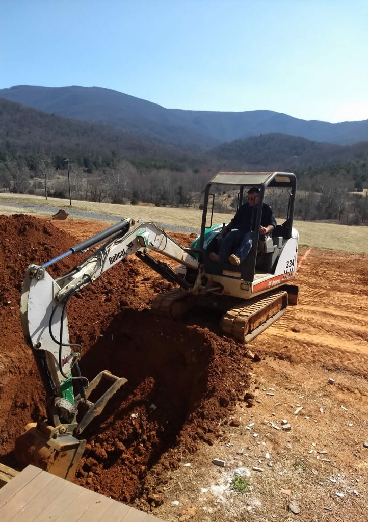 14 March 2019 - Mark Good preparing a trench for conduit.