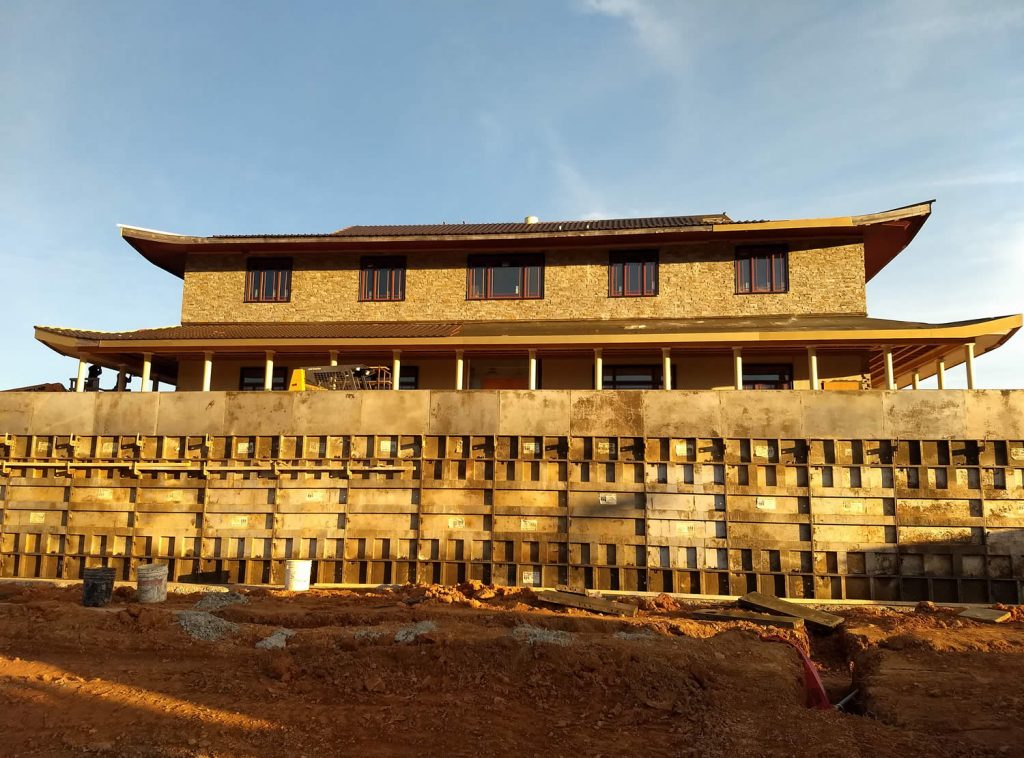 28 March, 2019 - Early morning sun illuminates the temple work-in-progress on HVAC unit enclosure.