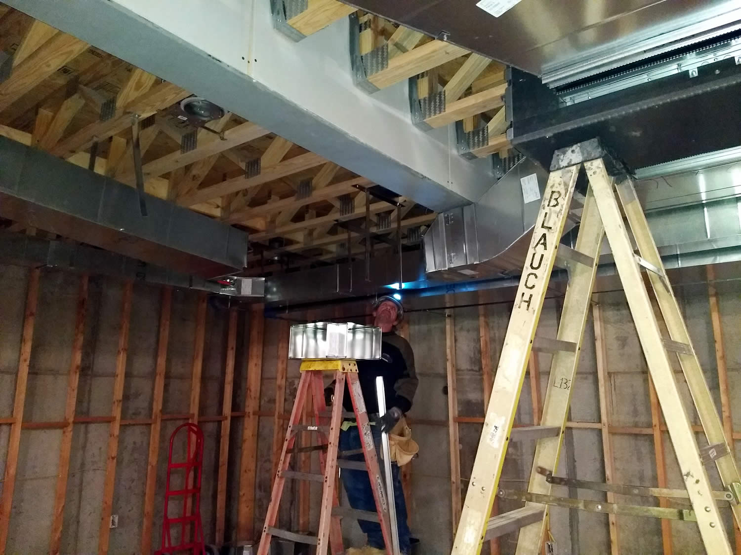 14 March 2019 - Installing HVAC ducts in basement of temple.