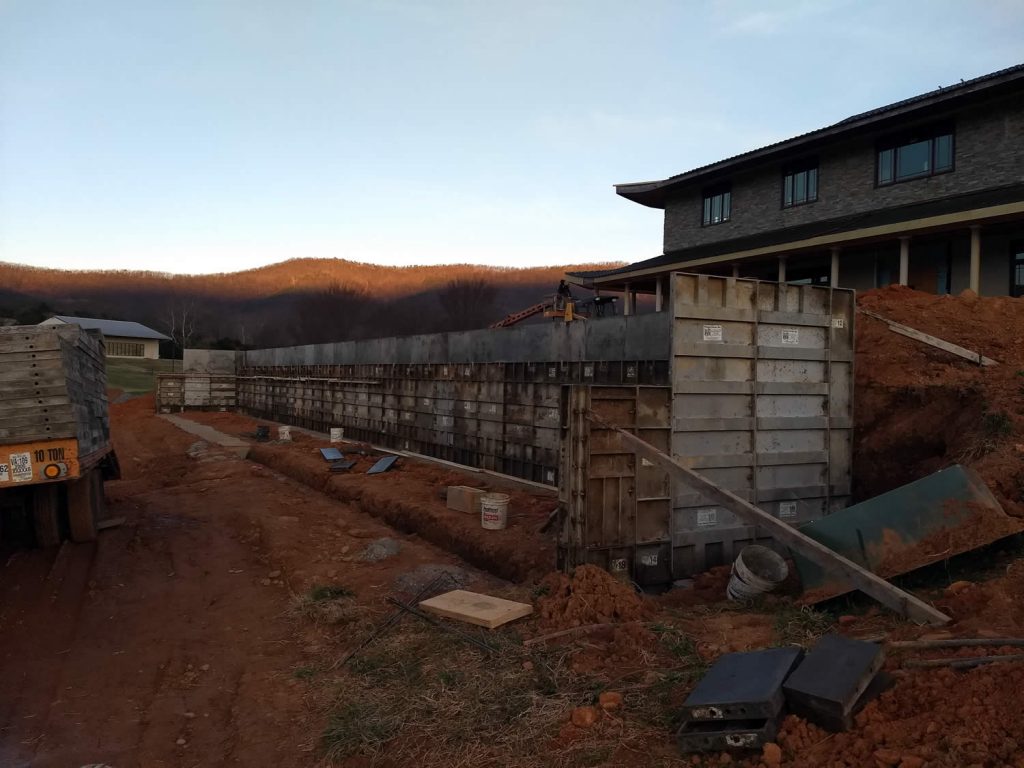 28 March 2019 - Forms for a retaining wall during construction of enclosure for HVAC (heating-cooling system) units.