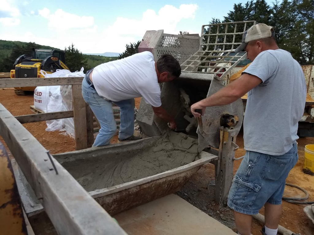 Stone masons mix concrete