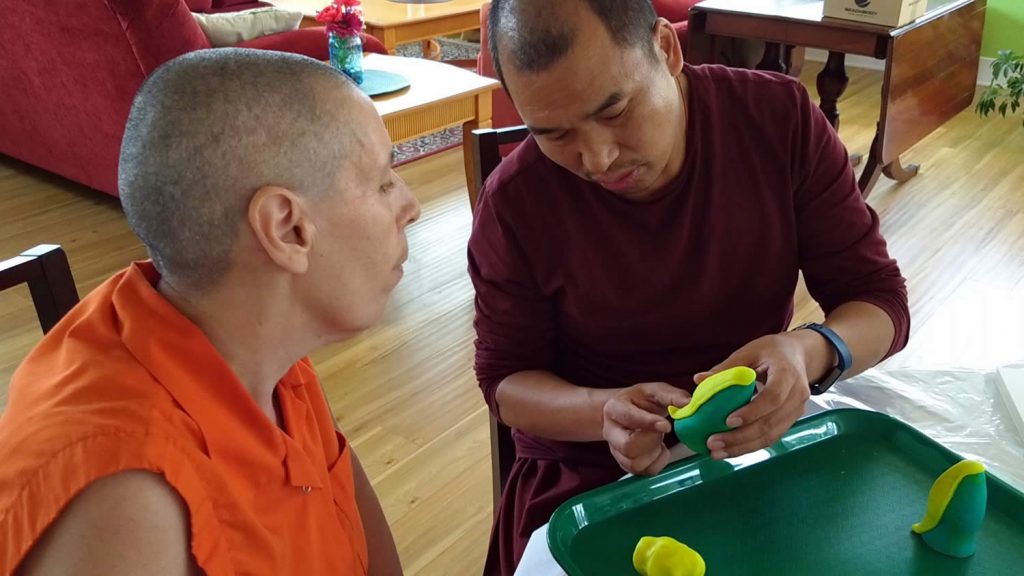 Ven. Lama Thrinley Gyaltsen and student during torma class