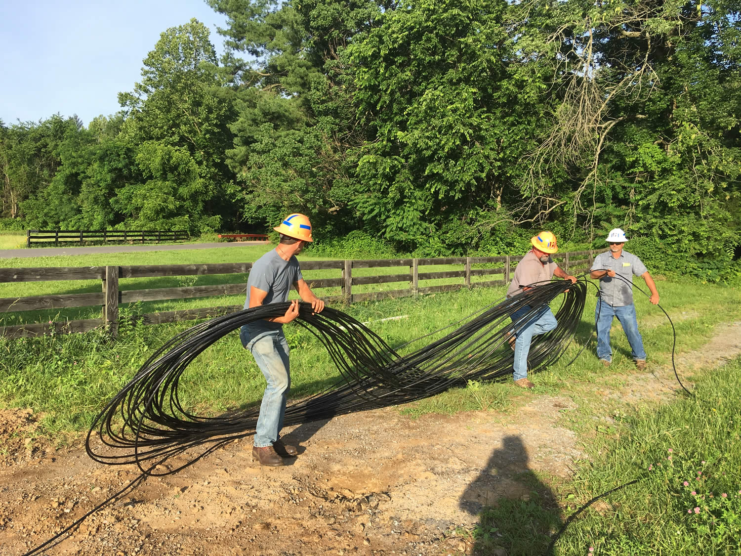 PennLine workers preparing fiber optic cable for pulling.