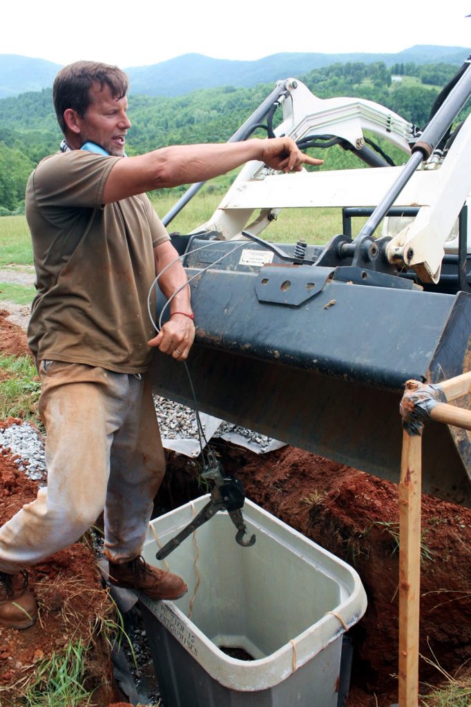 Dean Baker positioning the hand-hole